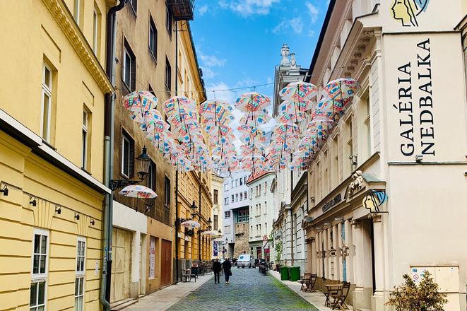 The Bratislava-based Nedbalka Gallery has installed umbrellas above the street where it is seated, creating  Umbrella Street for the third time in its history.