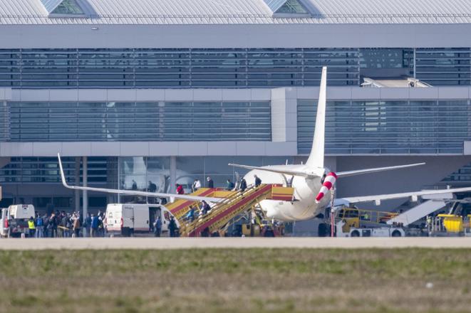 Slovaks get off a plane from Stockholm, Sweden, which landed at Bratislava airport on March 29, 2020.