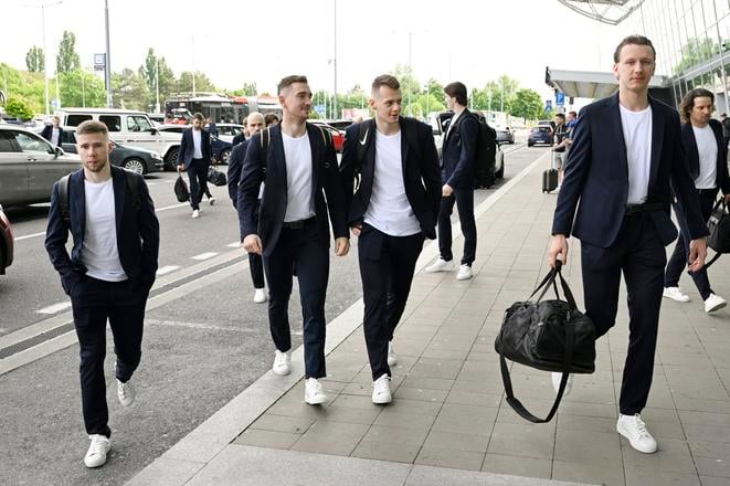 Slovak ice-hockey players arriving at the Bratislava airport to fly to Sweden. From left: Matúš Sukeľ, Dávid Mudrák and Andrej Golian.