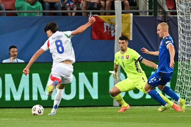 From left: Italy's Cesare Casadei is about to score a goal into Slovakia's net.