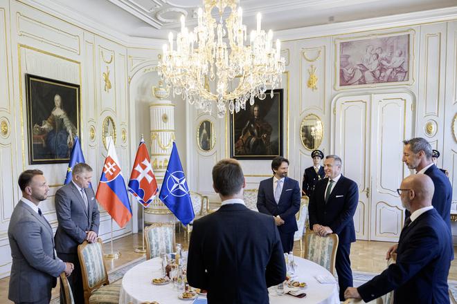 President Peter Pellegrini hosted a roundtable on defence spending with leaders of parliamentary parties. Pictured on 17 June 2025 in Bratislava, awaiting the president’s arrival (left to right): Interior Minister Matúš Šutaj Eštok (Hlas), Prime Minister Robert Fico (Smer, second from left), Michal Šimečka (Progressive Slovakia, centre foreground), Branislav Gröhling (SaS, right foreground), Milan Majerský (KDH, far right), Andrej Danko (SNS, back right), and Defence Minister Robert Kaliňák (Smer, back centre).