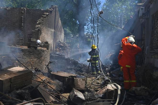 Emergency services personnel work to extinguish a fire following a Russian attack in Odesa, Ukraine, Friday, 11 July 2025.