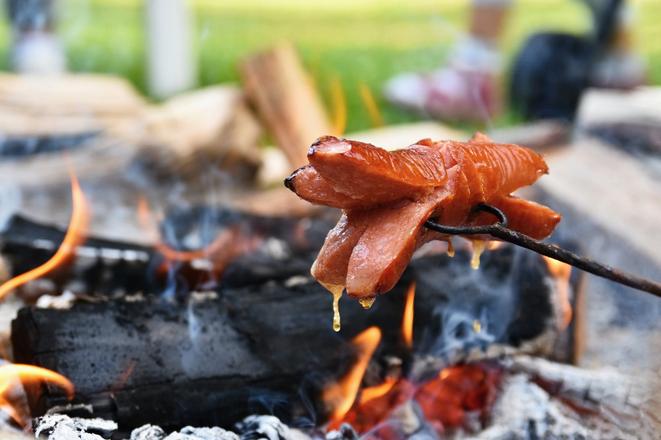 Roasting over a fire.