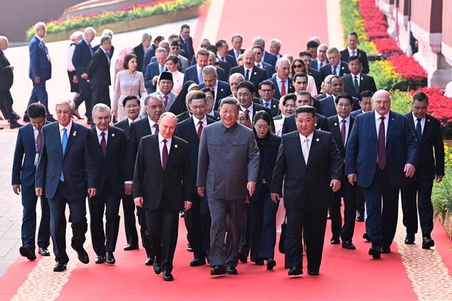 In this photo released by Xinhua News Agency, Chinese President Xi Jinping, centre, and foreign leaders including Russia President Vladimir Putin, centre left, and North Korean leader Kim Jong Un, centre right, walk to Tiananmen Rostrum ahead of a ceremony to commemorate the 80th anniversary of Japan's World War II surrender in Beijing, China, on 3 September 2025.