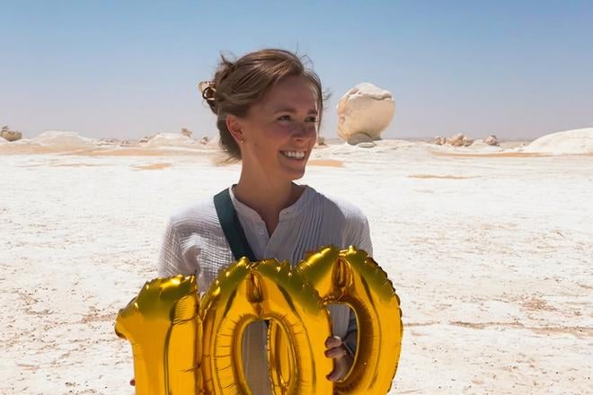 Kelsey Yurek visiting White Desert National Park in her 100th country, Egypt, on 19 June 2023.