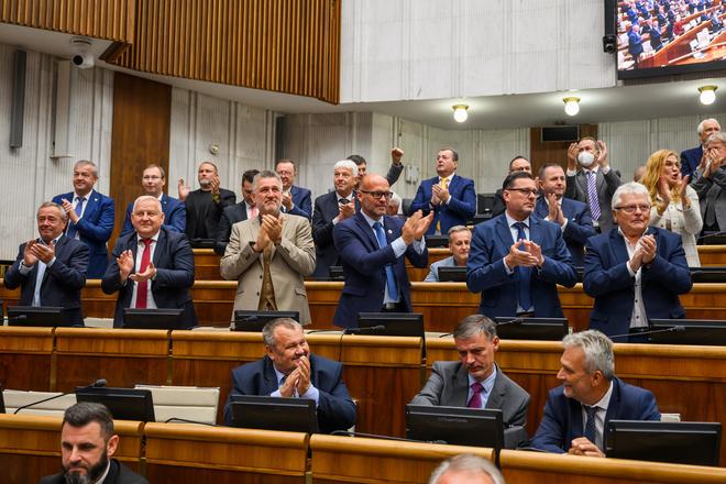 Smer MPs cheer after the amendment to the constitution was approved on September 26.