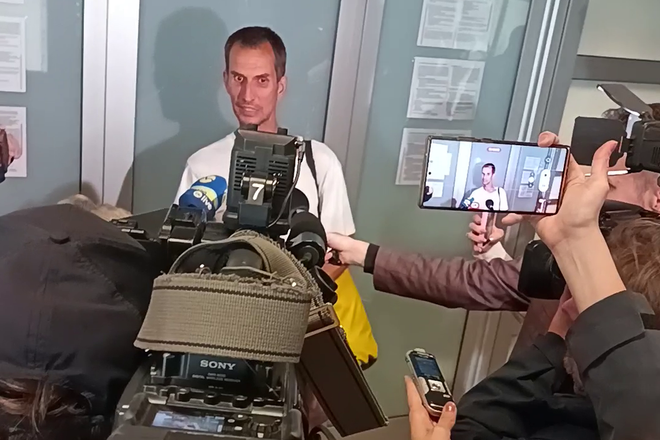Peter Švestka speaks to reporters after landing at M. R. Štefánik Airport in Bratislava.