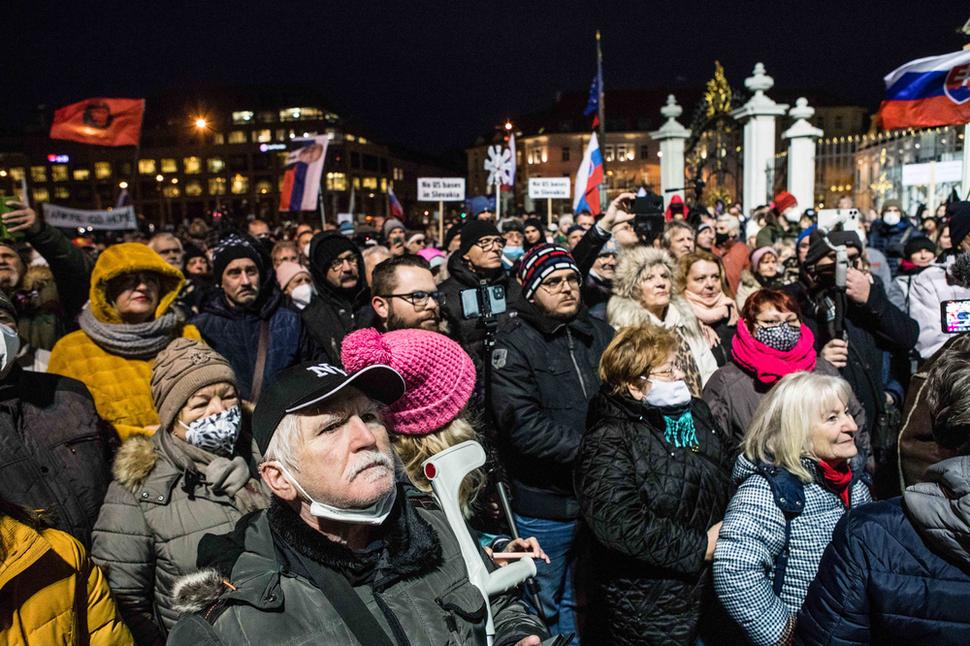 The crowd gathered in front of the Presidential Palace, many of participants not wearing masks.
