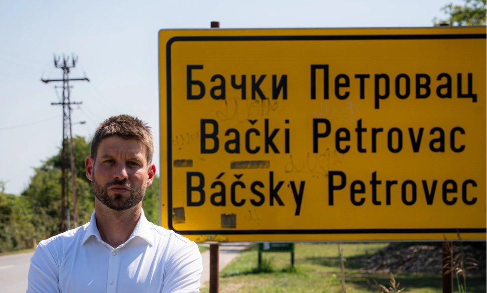 Progressive Slovakia leader Michal Šimečka in front of the welcome sign to Bački Petrovac, 13 August 2025.