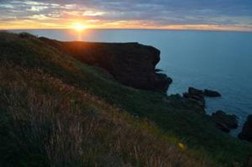 Východ slnka nad Seaton cliffs