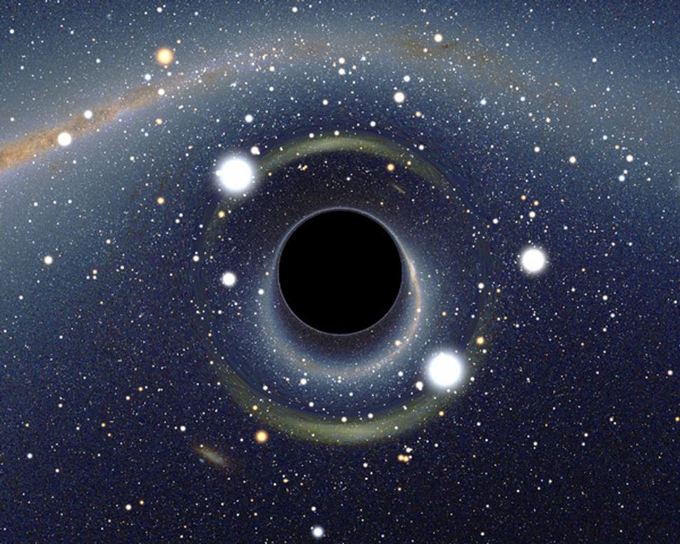 Počítačová simulácia čiernej diery. Vidno gravitačný ohyb svetla okolo samotnej diery.