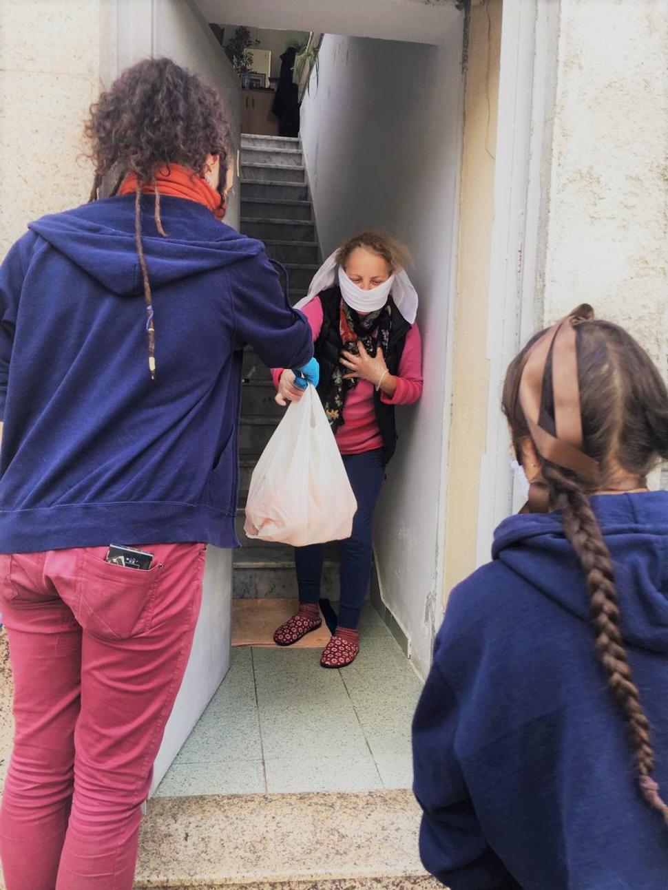 Arantxa Ferrer (on the left) together with another volunteer joined the initiative "Adopt grandma/ grandpa" within which they distributed the food to senior. Usually, Arantxa provides the physiotherapy in the centre of the NCCS organisation in Albania.